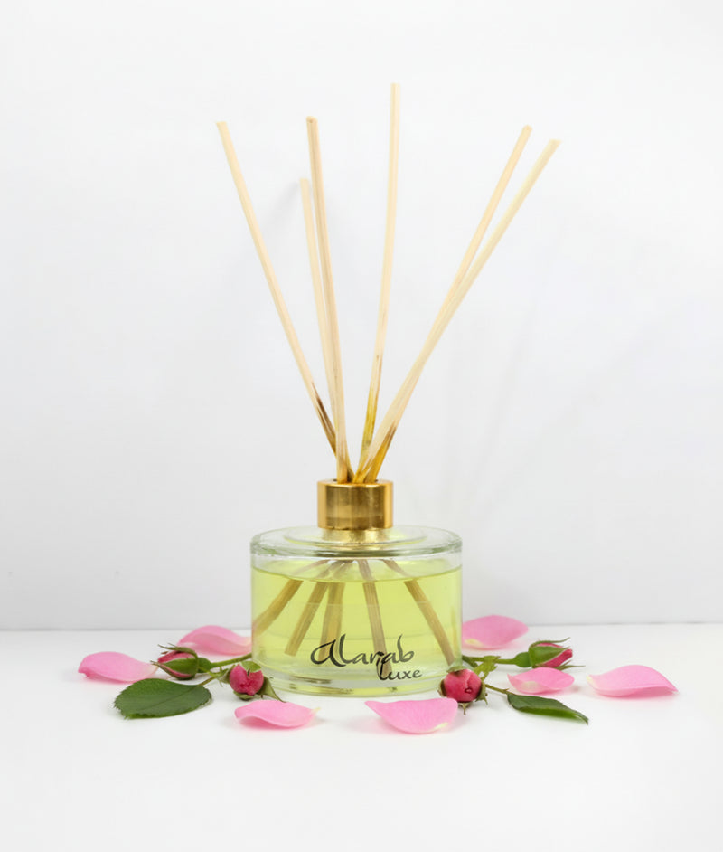 French Rose reed diffuser with rattan sticks in glass bottle, front view